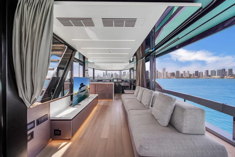 Slide: The Image of Luxurious interior of 2021 Explorer 62 yacht with panoramic ocean views and modern furnishings. - 14