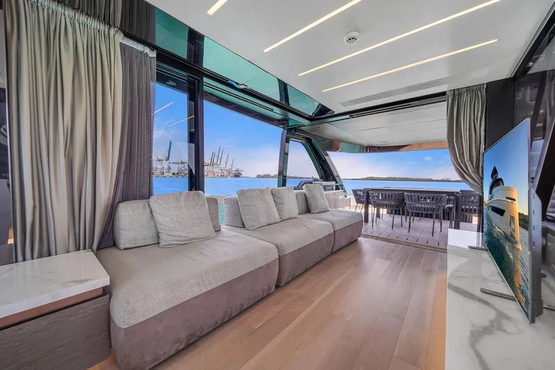 Slide: The Image of Luxurious interior of 2021 Explorer 62 yacht with spacious seating and ocean view. - 17