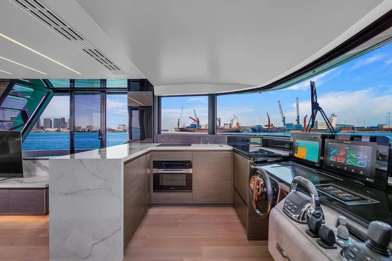 Slide: The Image of Luxurious 2021 Explorer 62 yacht interior with modern kitchen and panoramic ocean views. - 26