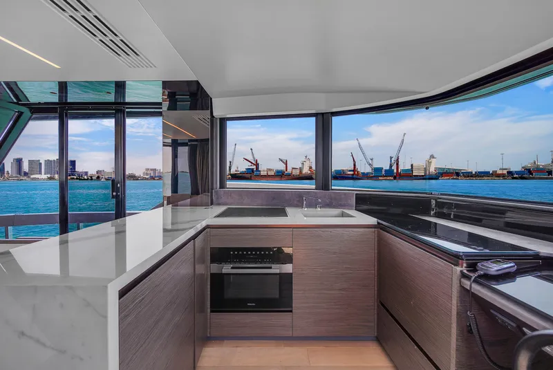 Slide: The Image of Modern kitchen interior on 2021 Explorer 62 yacht with ocean view and sleek design. - 27