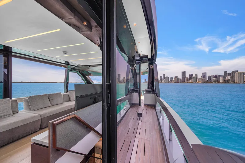 Slide: The Image of Luxurious 2021 Explorer 62 yacht with modern interior, overlooking a vibrant city skyline. - 31