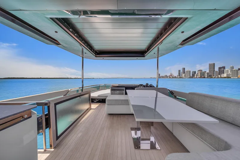 Slide: The Image of Luxurious 2021 Explorer 62 yacht deck with city skyline and ocean view. - 46