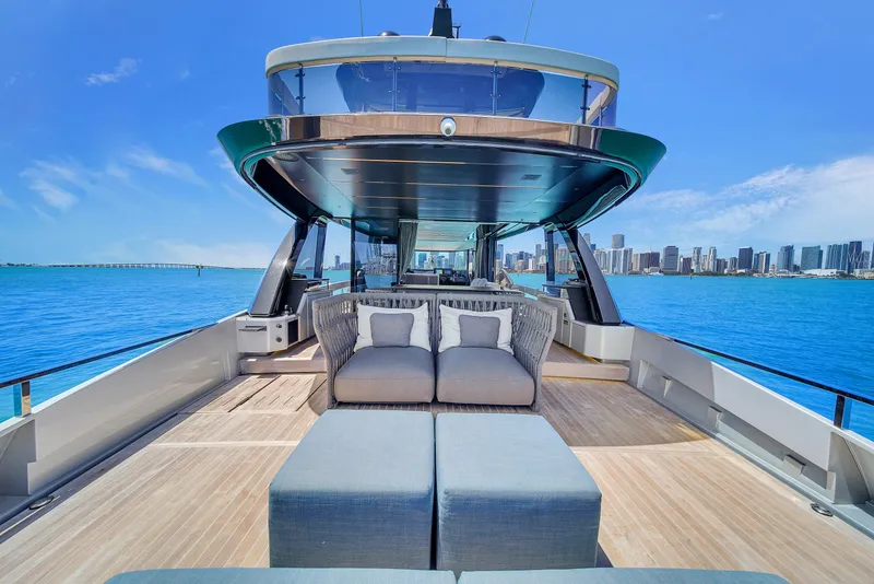 Slide: The Image of Luxurious 2021 Explorer 62 yacht with spacious deck and city skyline view. - 7