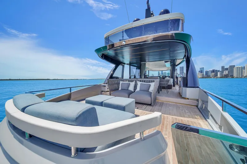 Slide: The Image of Luxurious 2021 Explorer 62 yacht with spacious deck, modern seating, and stunning ocean view. - 8