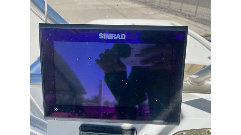Slide: The Image of Simrad display on 2018 Mako Pro Skiff 19 CC boat dashboard. - 13