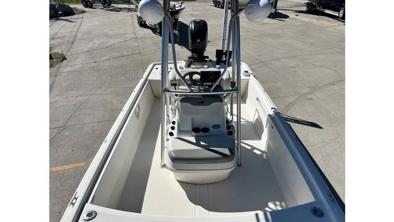 Slide: The Image of 2018 Mako Pro Skiff 19 CC boat interior with center console and seating. - 8