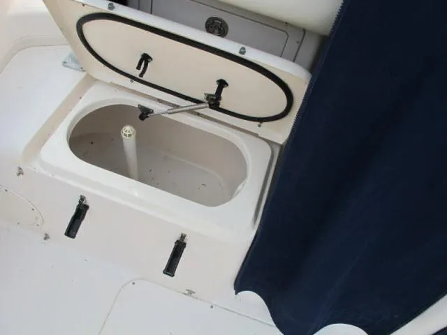 Slide: The Image of Open storage compartment on 2005 Grady-White 282 Sailfish boat deck. - 11