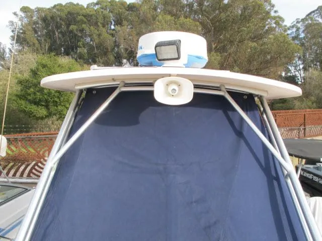 Slide: The Image of 2005 Grady-White 282 Sailfish boat with radar and blue canvas cover. - 2