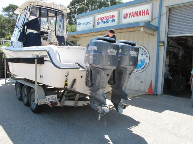 Slide: The Image of 2005 Grady-White 282 Sailfish boat with twin Yamaha 250 engines on a trailer. - 23