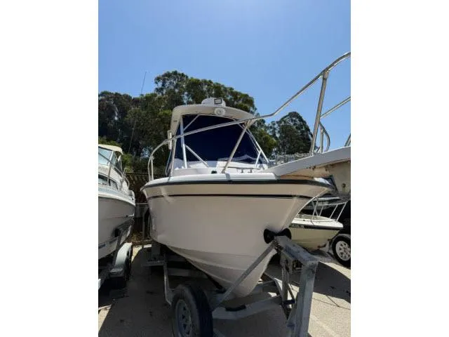 Slide: The Image of 2005 Grady-White 282 Sailfish boat on trailer under clear blue sky. - 26