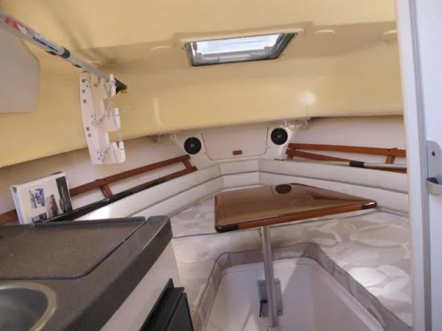 Slide: The Image of 2005 Grady-White 282 Sailfish cabin interior with seating and table. - 29