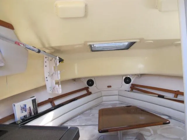 Slide: The Image of 2005 Grady-White 282 Sailfish cabin interior with seating and table. - 30