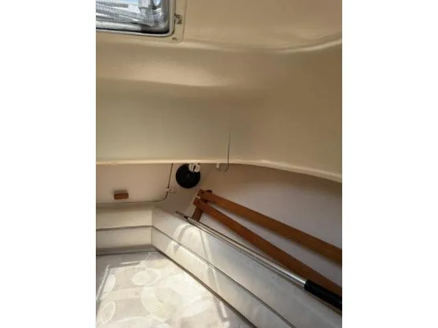 Slide: The Image of Interior of 2005 Grady-White 282 Sailfish boat, featuring seating and storage area. - 34