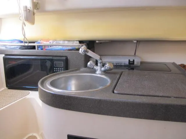 Slide: The Image of 2005 Grady-White 282 Sailfish boat interior with sink and microwave. - 40
