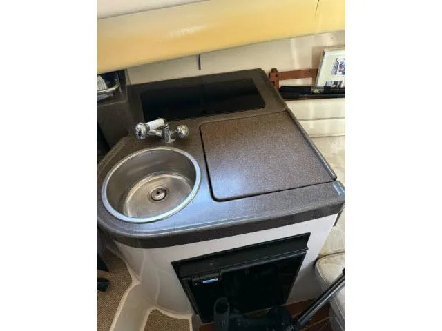 Slide: The Image of Compact kitchenette in 2005 Grady-White 282 Sailfish boat with sink and countertop. - 41