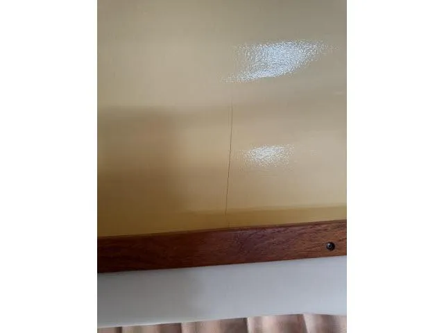 Slide: The Image of Interior detail of 2005 Grady-White 282 Sailfish boat, showing a surface crack. - 44