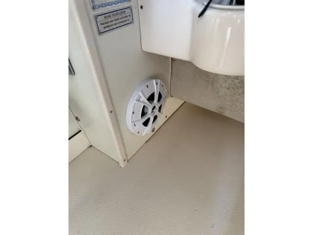 Slide: The Image of Interior of 2005 Grady-White 282 Sailfish boat showing a white speaker. - 47