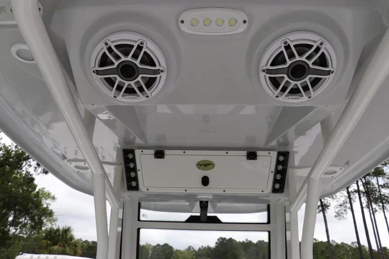 Slide: The Image of 2024 Tidewater 256 LXF boat speakers and lighting on the overhead console. - 16