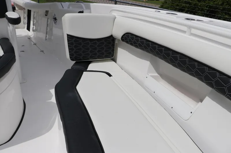 Slide: The Image of 2024 Tidewater 256 LXF boat interior with black and white seating. - 35