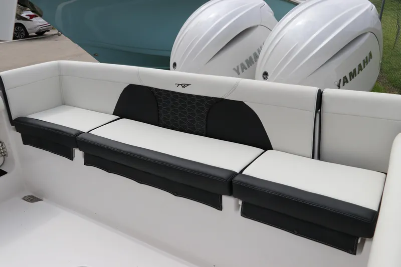 Slide: The Image of 2024 Tidewater 256 LXF boat seating with Yamaha engines in the background. - 4