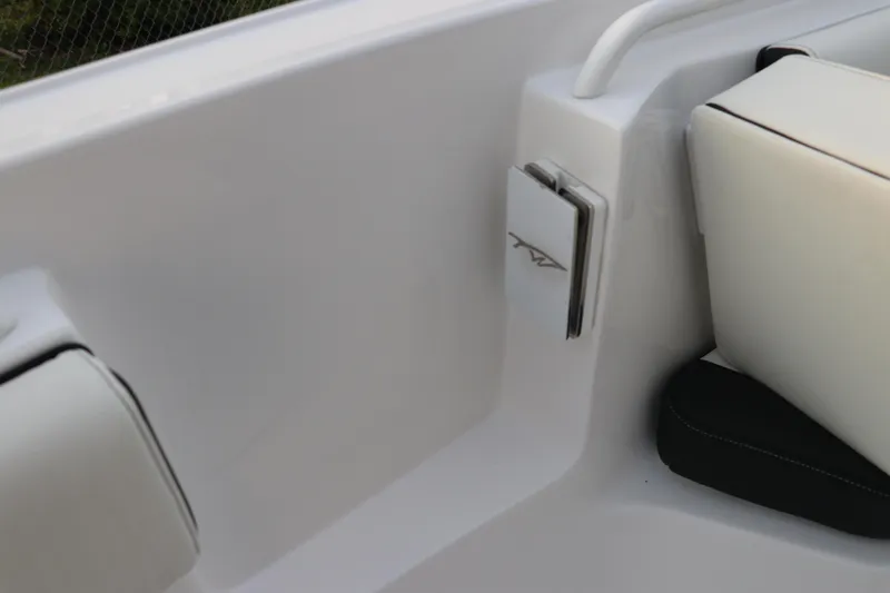 Slide: The Image of 2024 Tidewater 256 LXF boat interior detail with sleek white seating and modern design. - 40