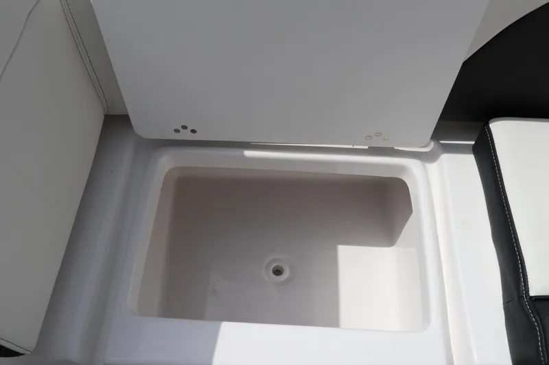 Slide: The Image of 2024 Tidewater 256 LXF boat storage compartment, open and empty. - 8