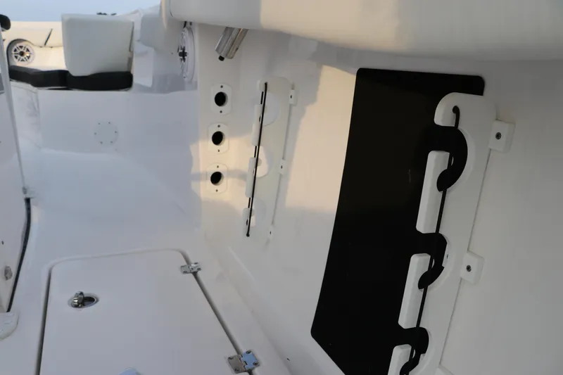 Slide: The Image of 2024 Tidewater 256 LXF boat interior, featuring sleek white design and modern fittings. - 9