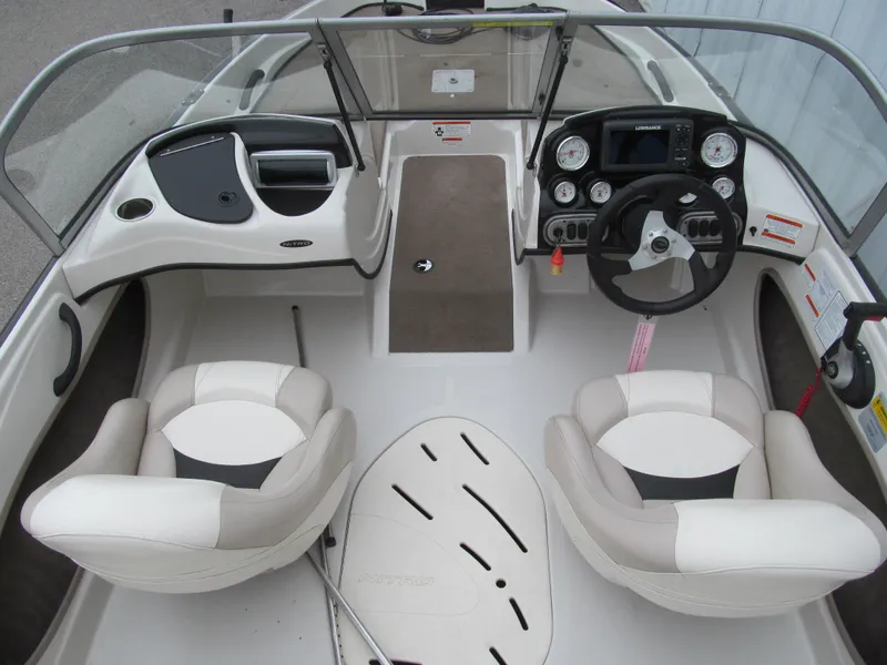 Slide: The Image of 2012 Nitro Z-7 Sport boat interior with dual seats and dashboard controls. - 4