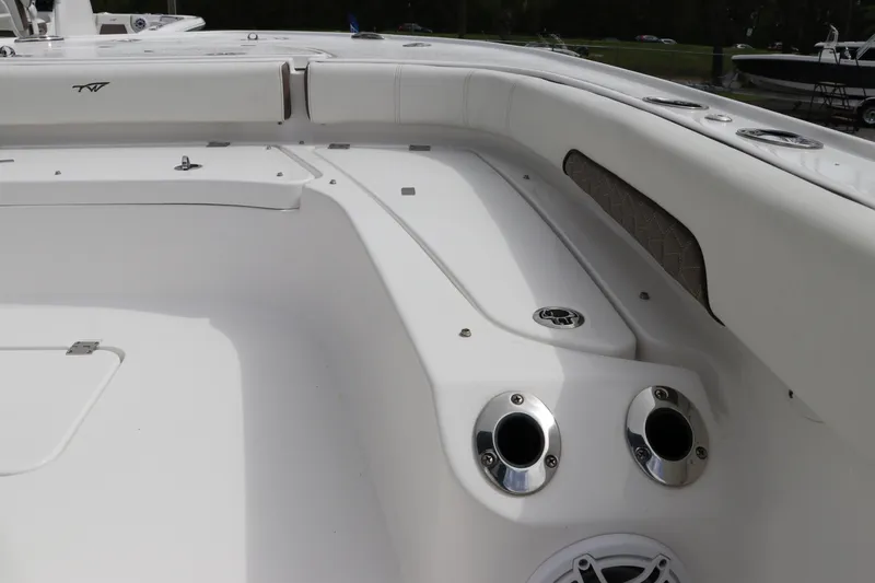 Slide: The Image of 2024 Tidewater 2500 Carolina Bay boat interior with rod holders and seating area. - 17