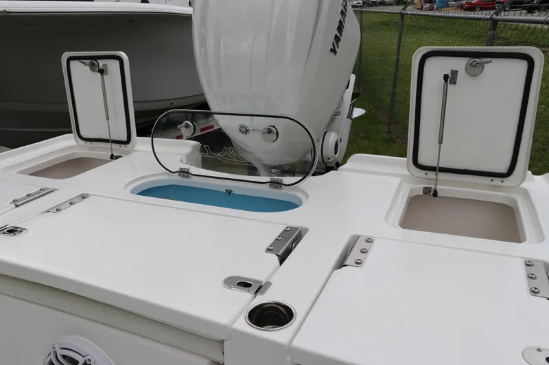 Slide: The Image of 2024 Tidewater 2500 Carolina Bay boat with Yamaha engine and storage compartments. - 3