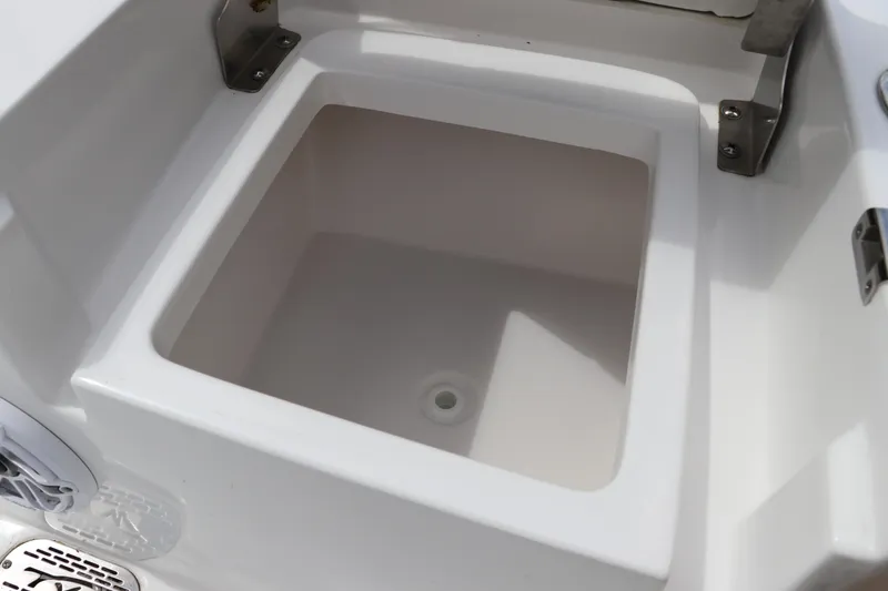 Slide: The Image of 2024 Tidewater 2500 Carolina Bay boat storage compartment, open and empty. - 6