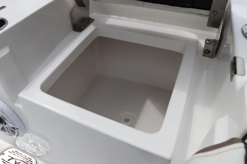 Slide: The Image of 2024 Tidewater 2500 Carolina Bay boat storage compartment, open and empty. - 7