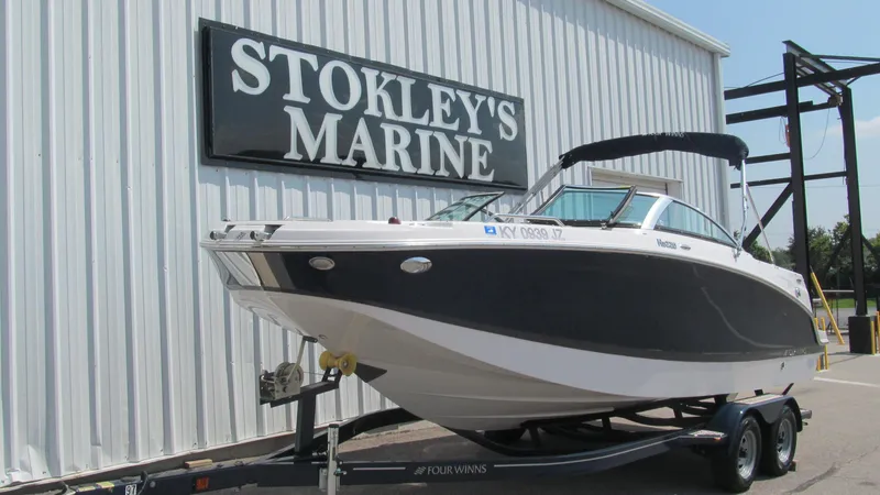 Slide: The Image of 2017 Four Winns HD220 boat on trailer at Stokley's Marine dealership. - 2