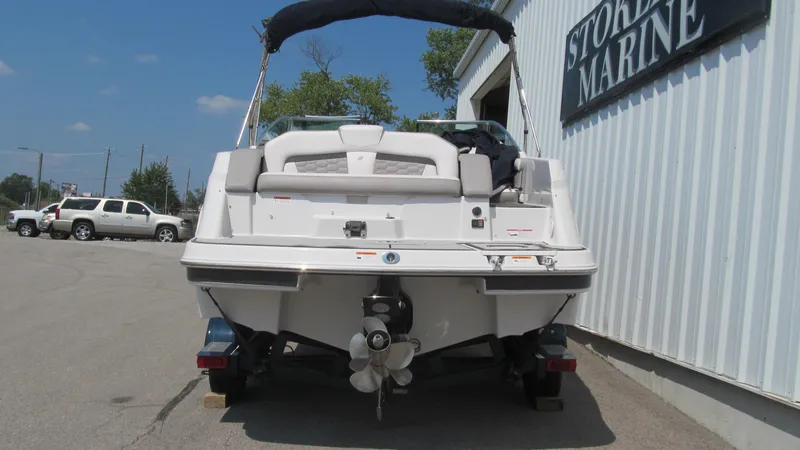 Slide: The Image of 2017 Four Winns HD220 boat parked outside a marine store. - 4