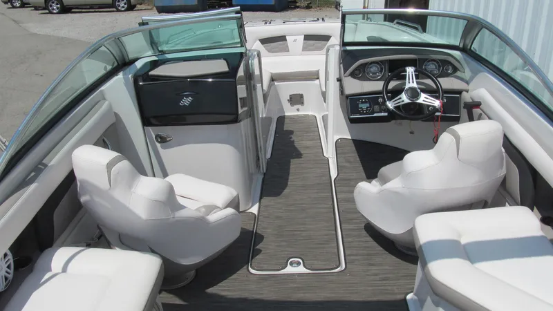 Slide: The Image of 2017 Four Winns HD220 boat interior with white seating and modern dashboard. - 5