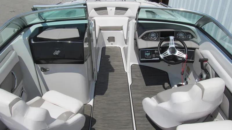 Slide: The Image of 2017 Four Winns HD220 boat interior with sleek seating and modern dashboard design. - 6