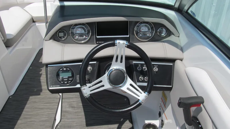 Slide: The Image of 2017 Four Winns HD220 boat dashboard with steering wheel and instrument panel. - 9