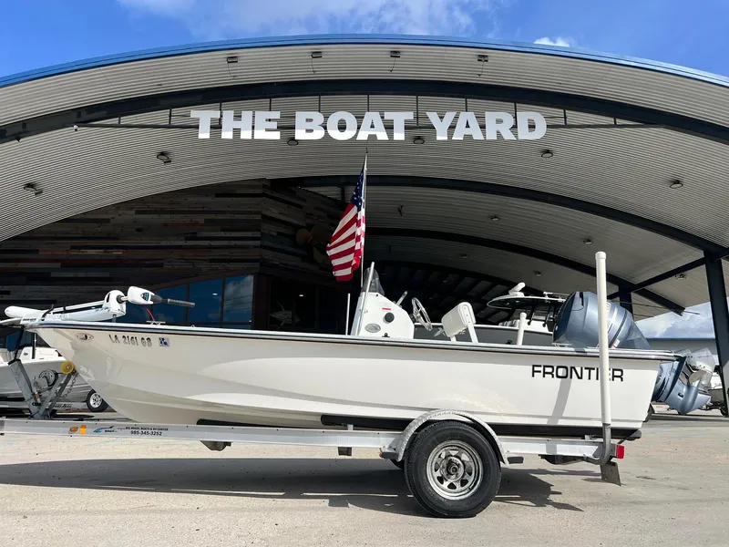 The Image of 2013 Frontier F-18 boat on trailer at The Boat Yard, with American flag. - 1