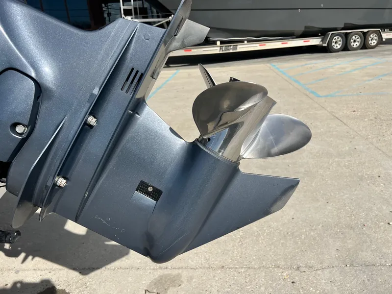 Slide: The Image of Close-up of a Frontier F-18 boat propeller, 2013 model, on a concrete surface. - 4