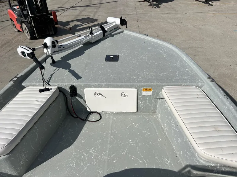 Slide: The Image of Frontier F-18 boat interior with white seating and mounted equipment, 2013 model. - 8