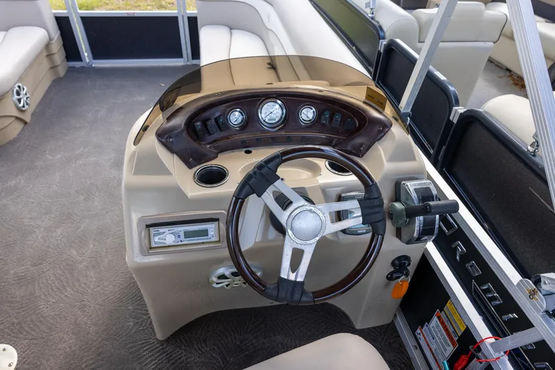 Slide: The Image of 2012 Bennington 22 SSL boat dashboard with steering wheel and instrument panel. - 6