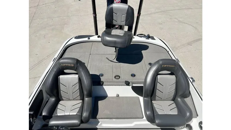 Slide: The Image of 2017 Nitro Z19 boat interior with three gray seats on deck. - 6