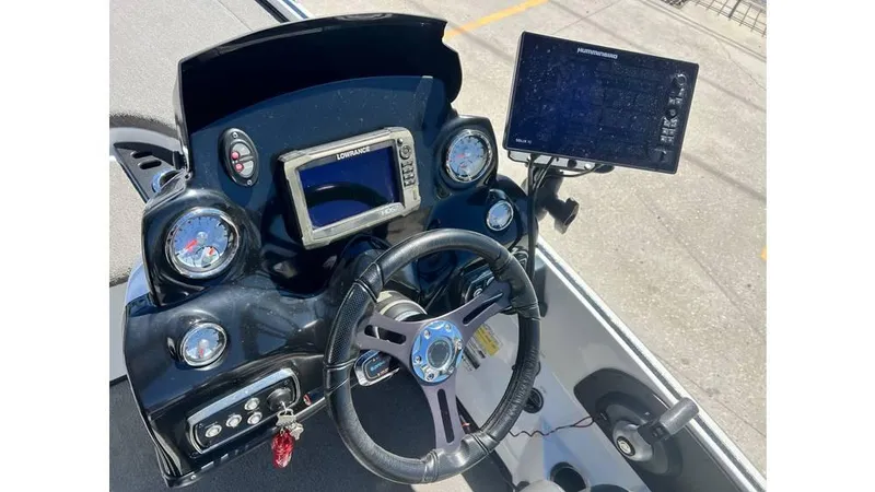 Slide: The Image of 2017 Nitro Z19 boat dashboard with steering wheel and electronic display. - 7