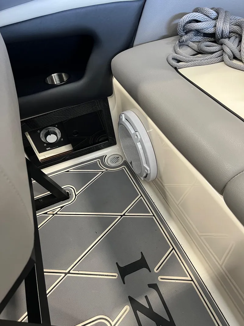 Slide: The Image of Interior of a 1997 Donzi 27 ZX boat with seating and speaker detail. - 12