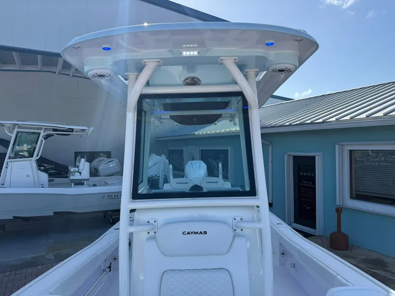 Slide: The Image of 2024 Caymas 26 HB boat with T-top and modern console design. - 27