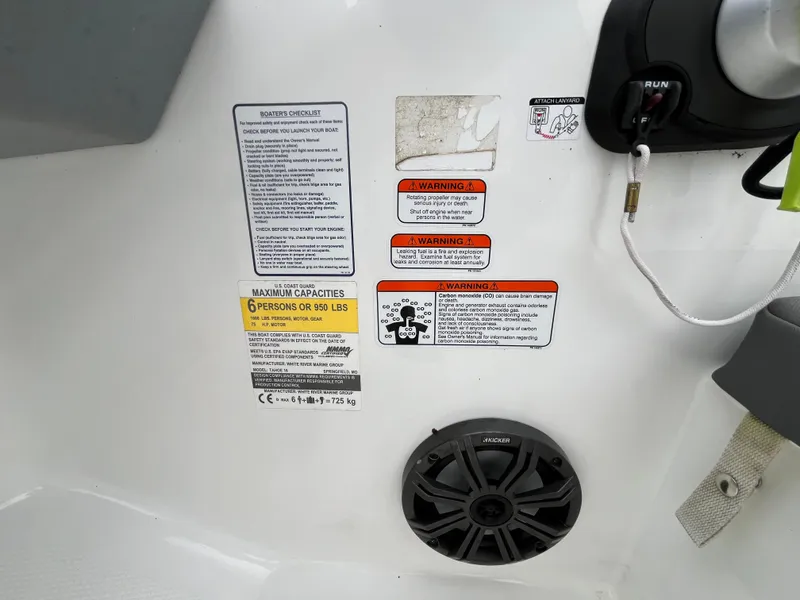 Slide: The Image of Safety and capacity labels on 2021 Tahoe T16 boat interior. - 25
