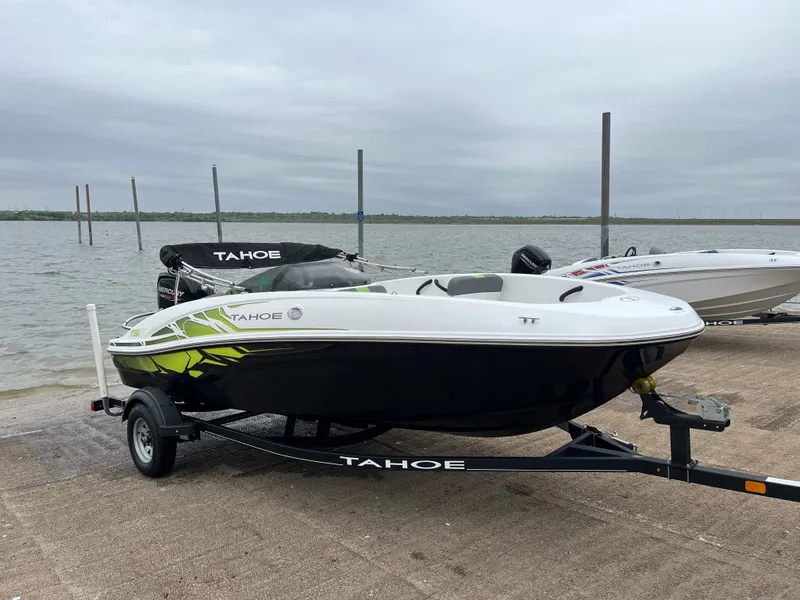 Slide: The Image of 2021 Tahoe T16 boat on trailer by the water, ready for launch. - 31