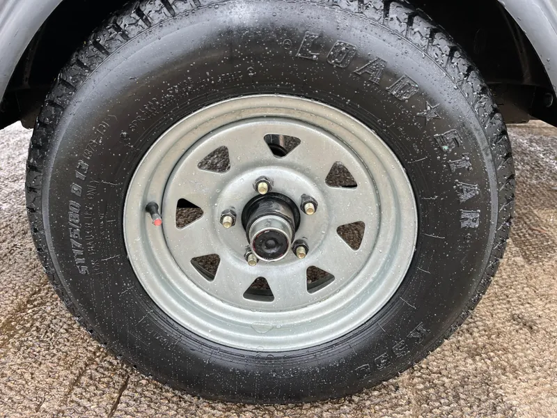 Slide: The Image of 2021 Tahoe T16 wheel with Loadstar tire on wet pavement. - 34