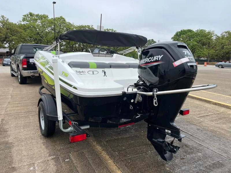 Slide: The Image of 2021 Tahoe T16 boat with Mercury engine on trailer in parking lot. - 37