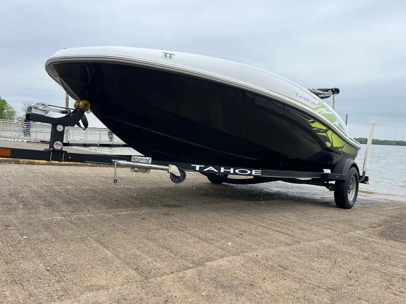 Slide: The Image of 2021 Tahoe T16 boat on trailer by the water. - 44